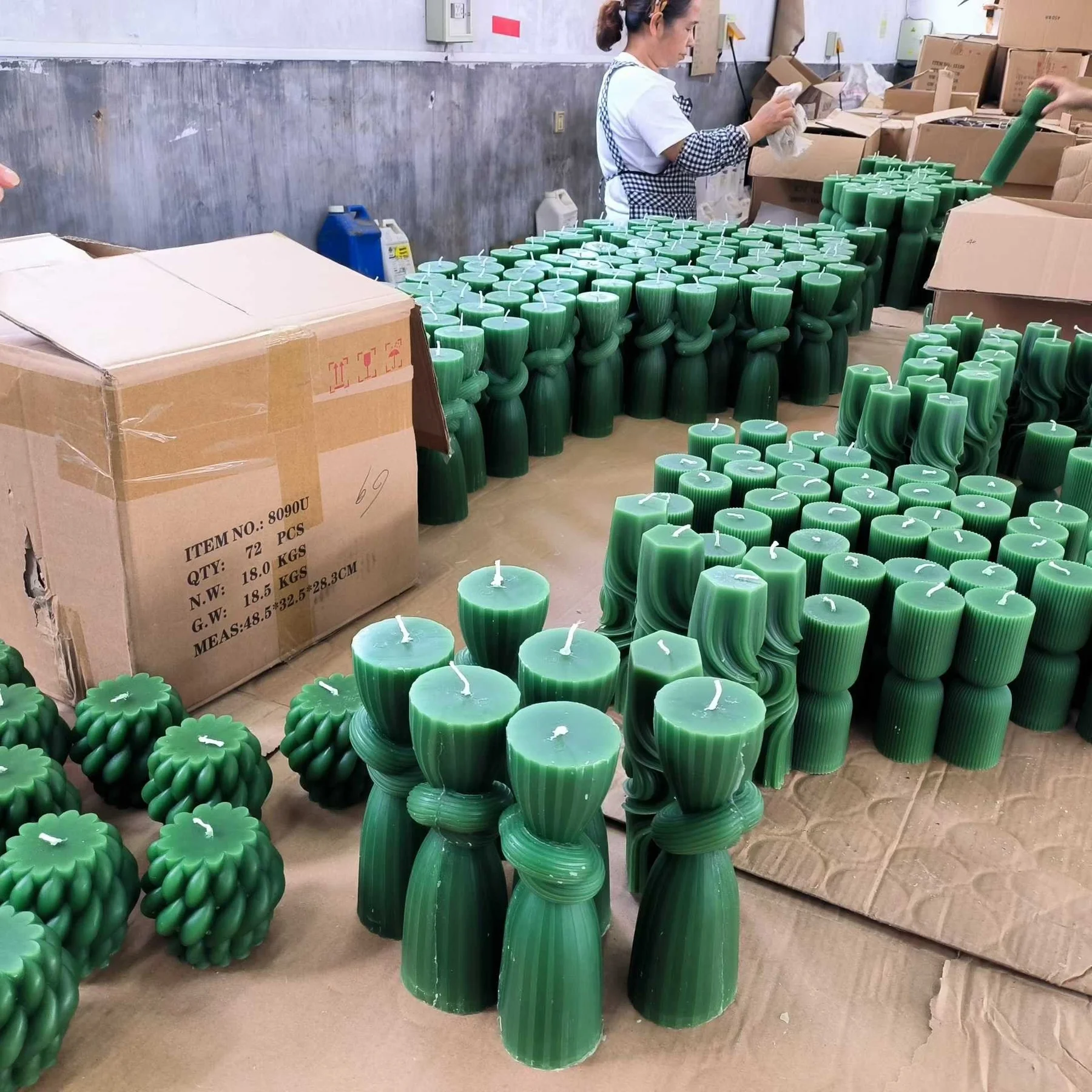 Pillar candles being moulded and finished