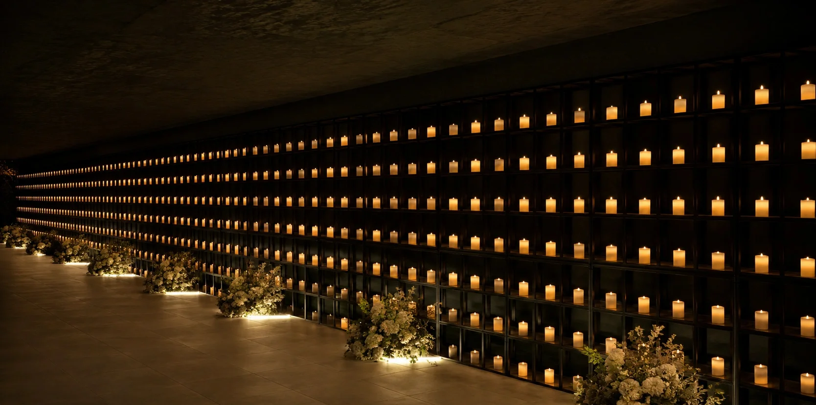 LED candle wall lighting a wedding aisle at an evening event