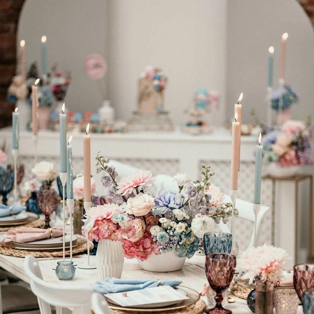 Candles styled across a wedding venue decoration setup